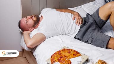 عوارض خوابیدن با معده پر چیست